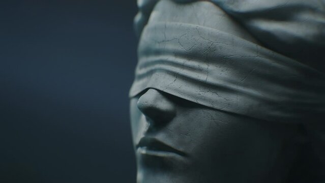 Cinematic and Atmospheric Close-up Shot of Lady Justice Sculpture Face. The Statue is Blindfolded and Holding Scales and Sword.
A Title Sequence for Court Show Mock-up.