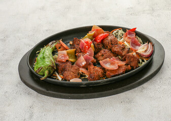 Indian dish of grilled meat with vegetables