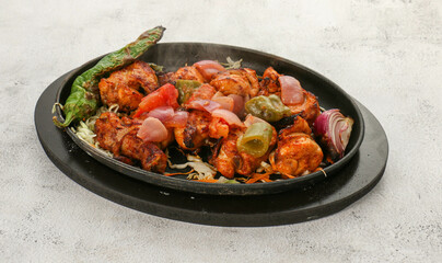 Indian dish of grilled meat with vegetables