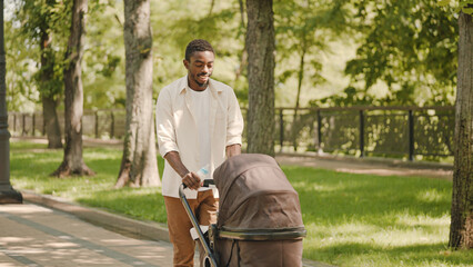 Happy dad holding bottle with milk, spending time with baby outdoors, parenthood