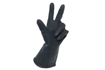 An isolated rubber black glove holding up the thumb, index and middle fingers on a white background. A hand doing the number three gesture.