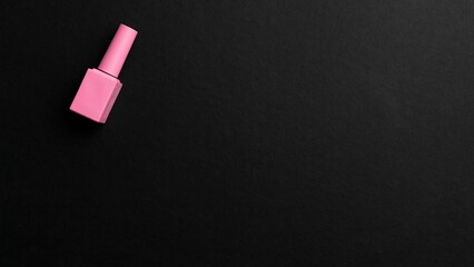 Pink manicure with copyspace in black background