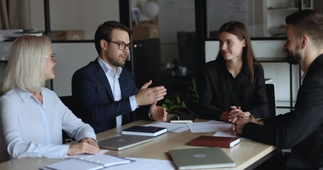 Businesspeople make agreement, decision and profitable deal, finish planning cooperation express respect shake hands accomplish meeting in modern conference room. Successful negotiations, business