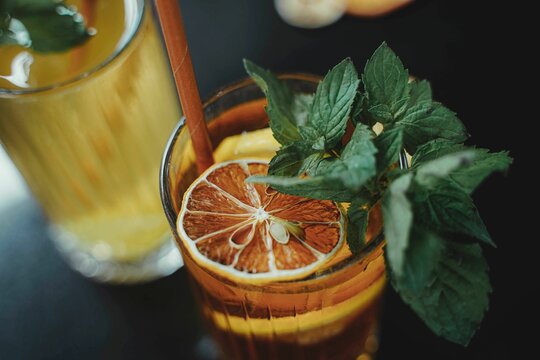 Closeup of an exotic and refreshing cold juice made of fruits served in a glass and with ice in it