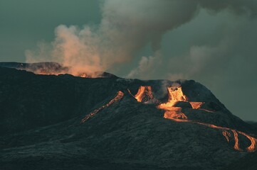Bursting volcano landscape with smoke and lava