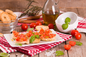 Friselle with cherry tomatoes and basil.