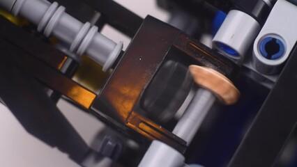 Educational toy for creativity mechanism and machines spins and rolls in children room, constructor for development of creative abilities macro. Kids activity knowledge teaching modeling