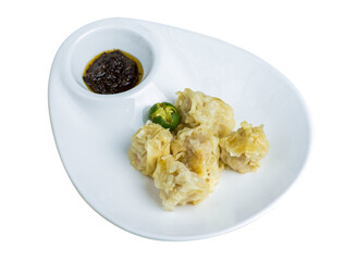shumai or Chinese steamed dumpling with sauce.