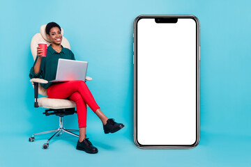 Photo of sweet pretty androgynous human wear green shirt typing modern device empty space isolated blue color background