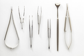 Surgical ophthalmological medical instruments, scissors, tweezers, on white background