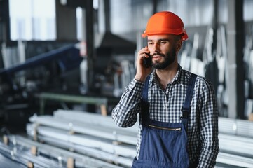 Man chooses metal profile for construction in Factory