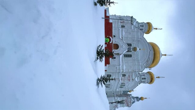 Belogorsky St. Nicholas Orthodox Missionary Monastery. Russia, Perm Krai, Belaya Gora. The temple on the hill in winter. Monastery on the background of snow. 4K