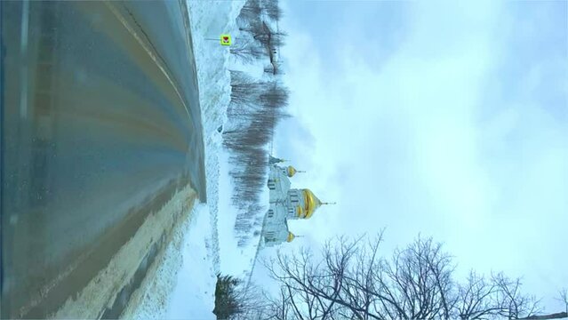 Belogorsky St. Nicholas Orthodox Missionary Monastery. Russia, Perm Krai, Belaya Gora. The temple on the hill in winter. Monastery on the background of snow. 4K