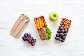 Lunch boxes with food ready to go and bamboo cutlery