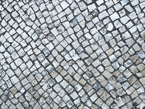 Portuguese roadway or Portuguese cobblestone, paving stone texture, mosaic shaped pavement, lisbon street floor, horizontal