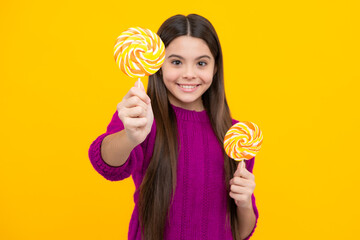 Teenage girl with lollipop, child eating sugar lollipops, kids sweets candy shop.