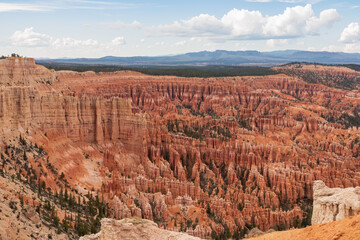 Panoramic aerial view of massive hoodoo sandstone rock formations in Bryce Canyon National Park, Utah, USA. Natural unique amphitheatre sculpted from the reddest rock of the Claron Formation. Awe
