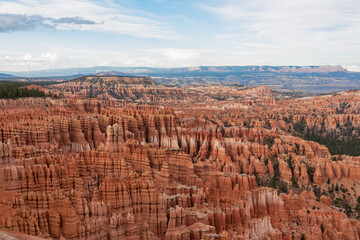 Panoramic aerial view of massive hoodoo sandstone rock formations in Bryce Canyon National Park, Utah, USA. Natural unique amphitheatre sculpted from the reddest rock of the Claron Formation. Awe