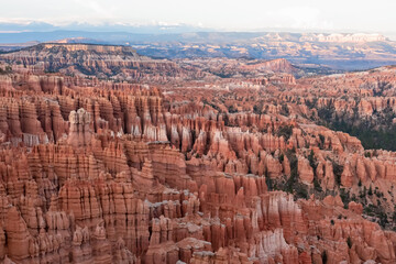 Fototapeta na wymiar Aerial sunset view of massive hoodoo sandstone rock formation boat mesa in Bryce Canyon National Park, Utah, USA. Last sun rays touching on natural unique amphitheatre sculpted from red rock. Twilight