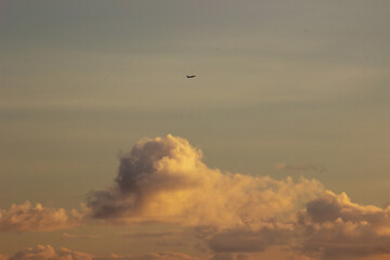 Plane in the sky at sunset