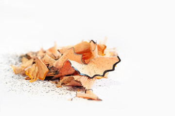 Pencil shavings. Wooden pencil shavings on white. Rubbish from sharpening