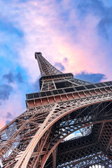 The Eiffel Tower in Paris against the backdrop of a beautiful evening sky.