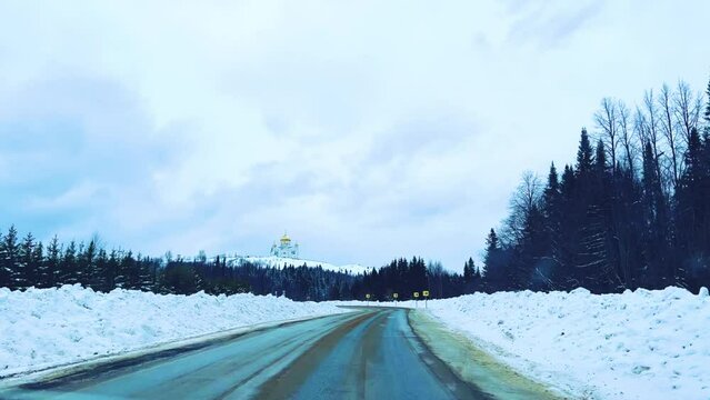 Belogorsky St. Nicholas Orthodox Missionary Monastery. Russia, Perm Krai, Belaya Gora. The temple on the hill in winter. Monastery on the background of snow. 4K