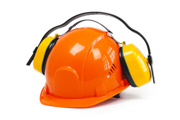 Close-up of an orange hard hat, safety, construction helmet and Noise-cancelling headphones, hearing protection, safety equipment, isolated on white.