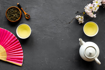 Japanese table setting with teapot and cups of tea