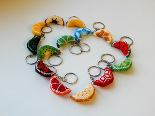 Colorful bead key chains on a white background