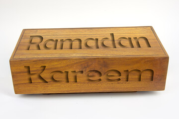 Ramadan Kareem, Ramadan greeting text engraved onTeak wooden box