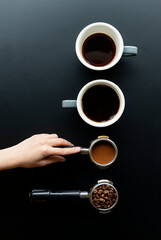 Girl's hand holding coffee utensils