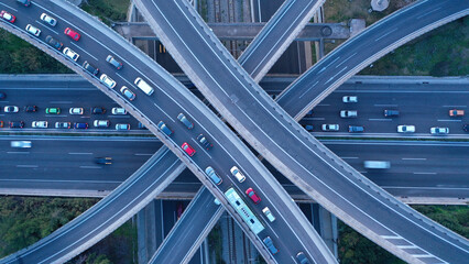 Aerial drone multilevel junction overpass highway with National toll road at rush hour with moderate traffic