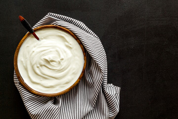 Bowl of sour cream or yogurt. Dairy product background