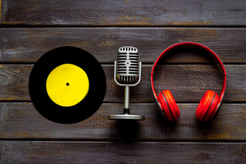 Podcasts or music concept with vinyl records and microphone, top view