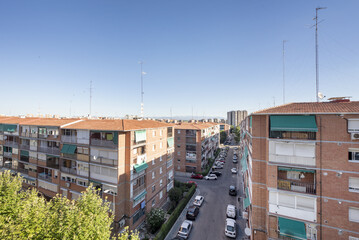 Fototapeta premium Blocks of brick buildings intended for residential housing of a modest character in a neighborhood of the city