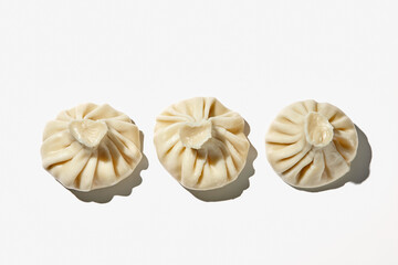 Cooked khinkali traditional georgian dish isolated on white background. Georgian traditional cuisine.