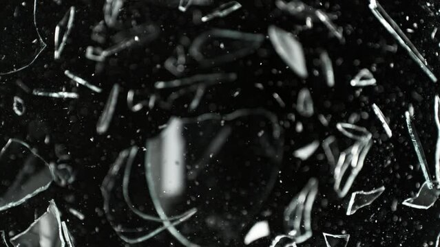 Super Slow Motion Shot of Breaking Real Glass at 1000 fps. Isolated on Black Background.