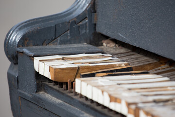 old wooden piano keyboard on street