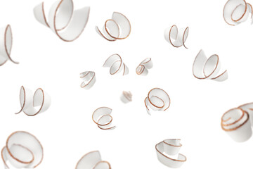 Falling Coconut curls, shavings, isolated on white background, selective focus