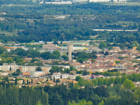 Aerial view of the town center of the small town of Senas in the Alpilles in Provence in France with the water tower in the center of the image