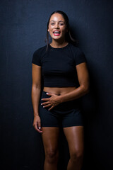 Naklejka na ściany i meble Close up image of a Dark Haired Girl Posing for a Fitness Photo shoot
