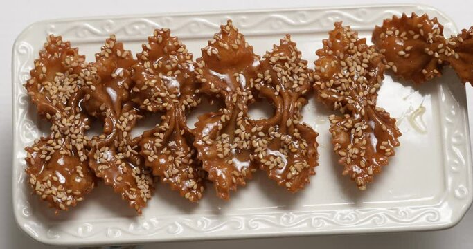 Harmony of Shapes and Colors: Chebakia on White Rectangular Plate