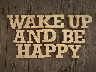 Wake up and be happy, text words typography written with wooden letter, life and business motivational inspirational