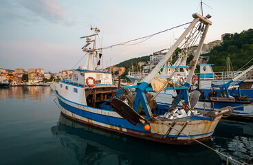 Small fishing boat moored in the port.