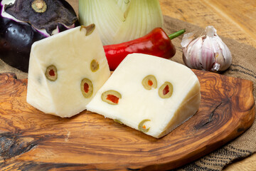 Cheese collection, fresh Italian pecorino cheese made from sheep milk filled with green olives...