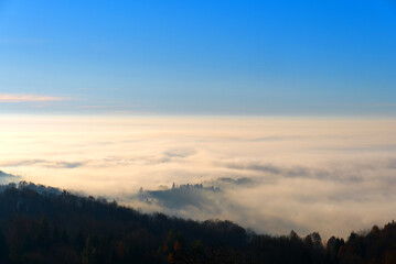 Morning fog in the countryside. Beautiful landscape view over the forest. 