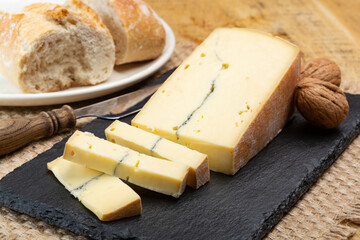 Cheese collection, French Morbier semi-soft cow milk cheese with black mold layer