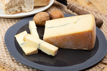Cheese collection, French Morbier semi-soft cow milk cheese with black mold layer