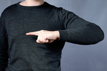 Hand with index finger showing direction to right. Directional or directional sign, pointing finger